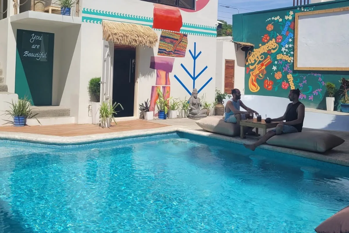The pool in front of the painted Happiness Boracay building