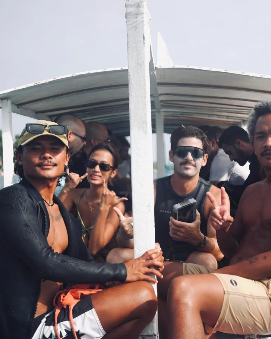 Friends smiling together on an island boat