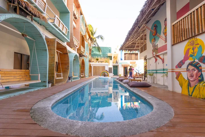 The long pool and murals at Happiness Hostel Boracay