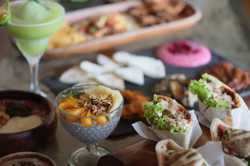 A colourful spread of shared plates, desserts and drinks