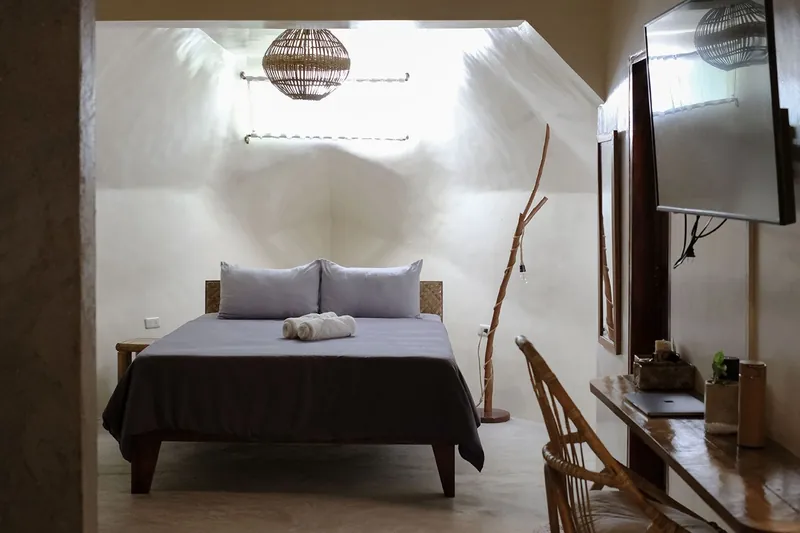 A calm private room with a double bed at the resort