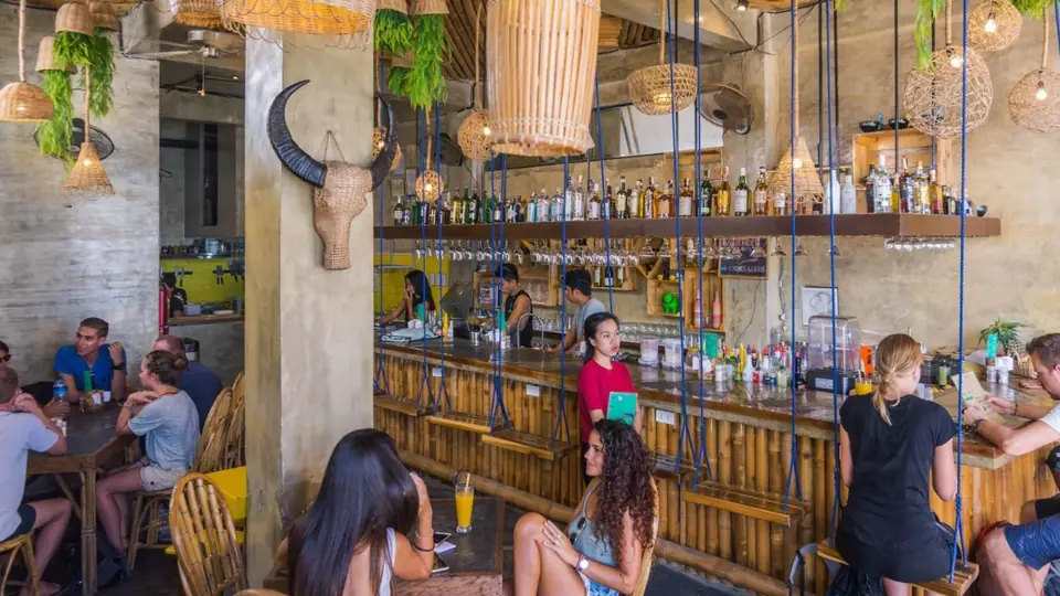 Guests hanging out at the colourful Happiness bar