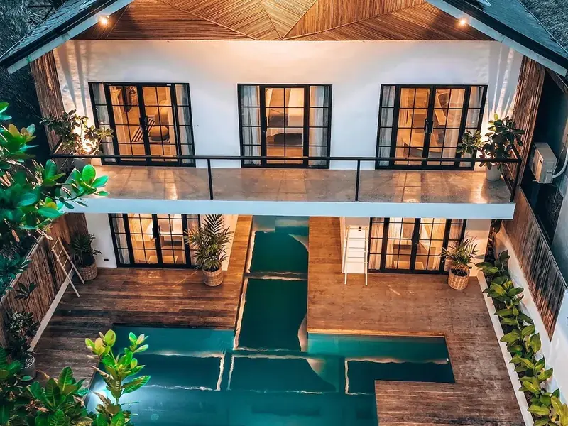 Aerial view of Bliss Villa with its long pool between two wings