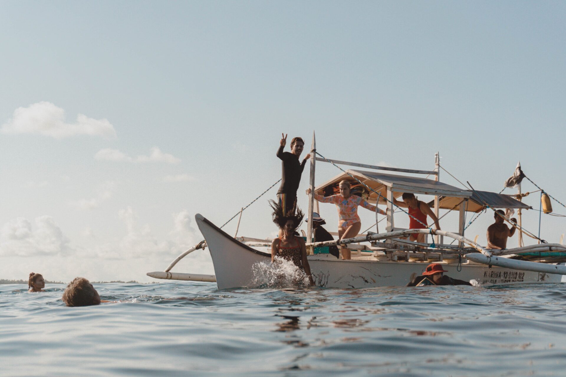 Guests on a bangka during a boat day in Siargao